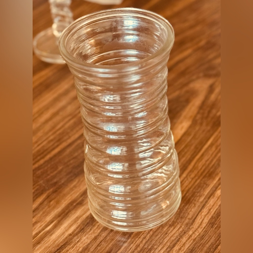 Glass Vase or kitchen cooking utensil holder.